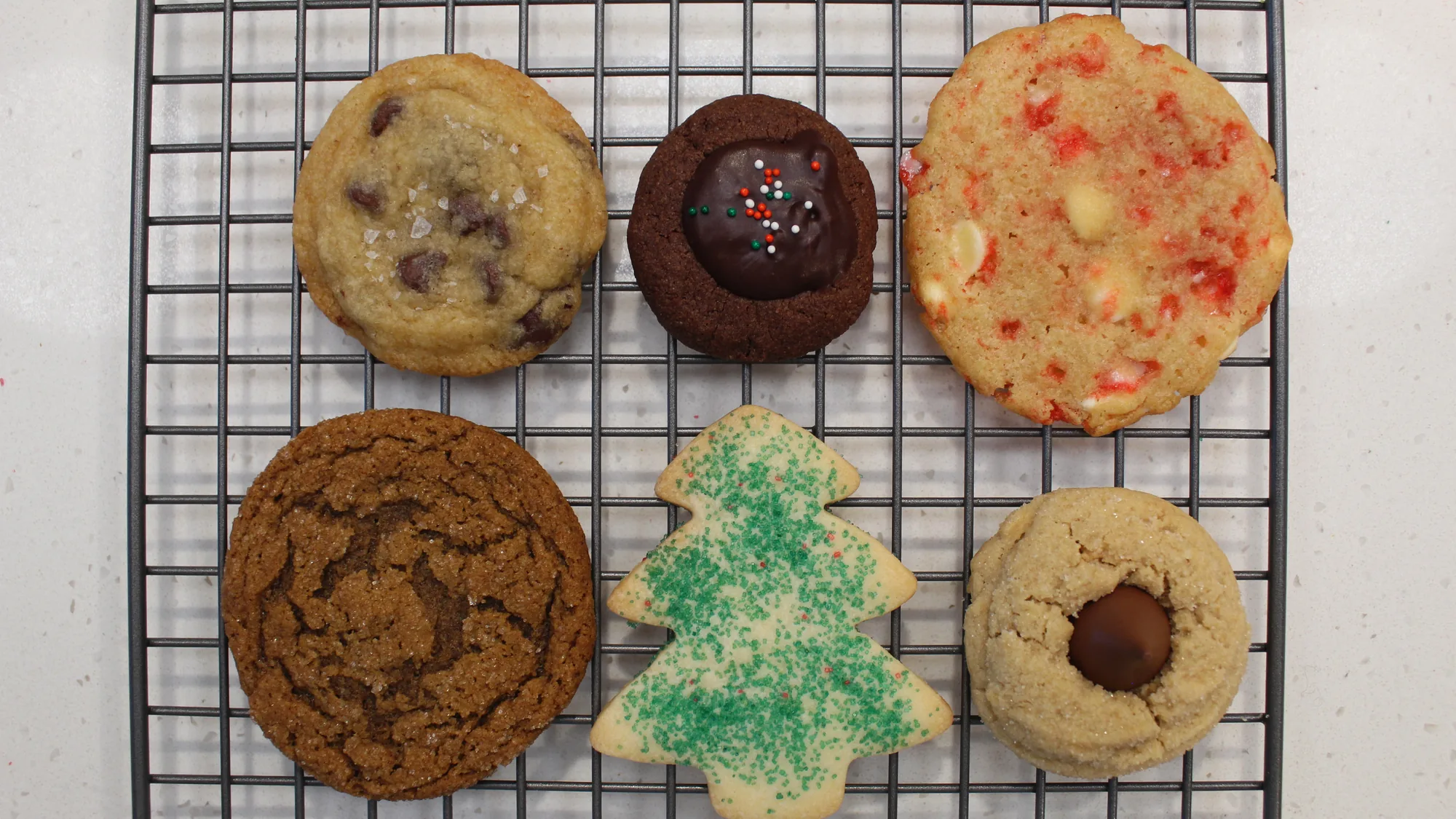 An assortment of cookies on a wire rack