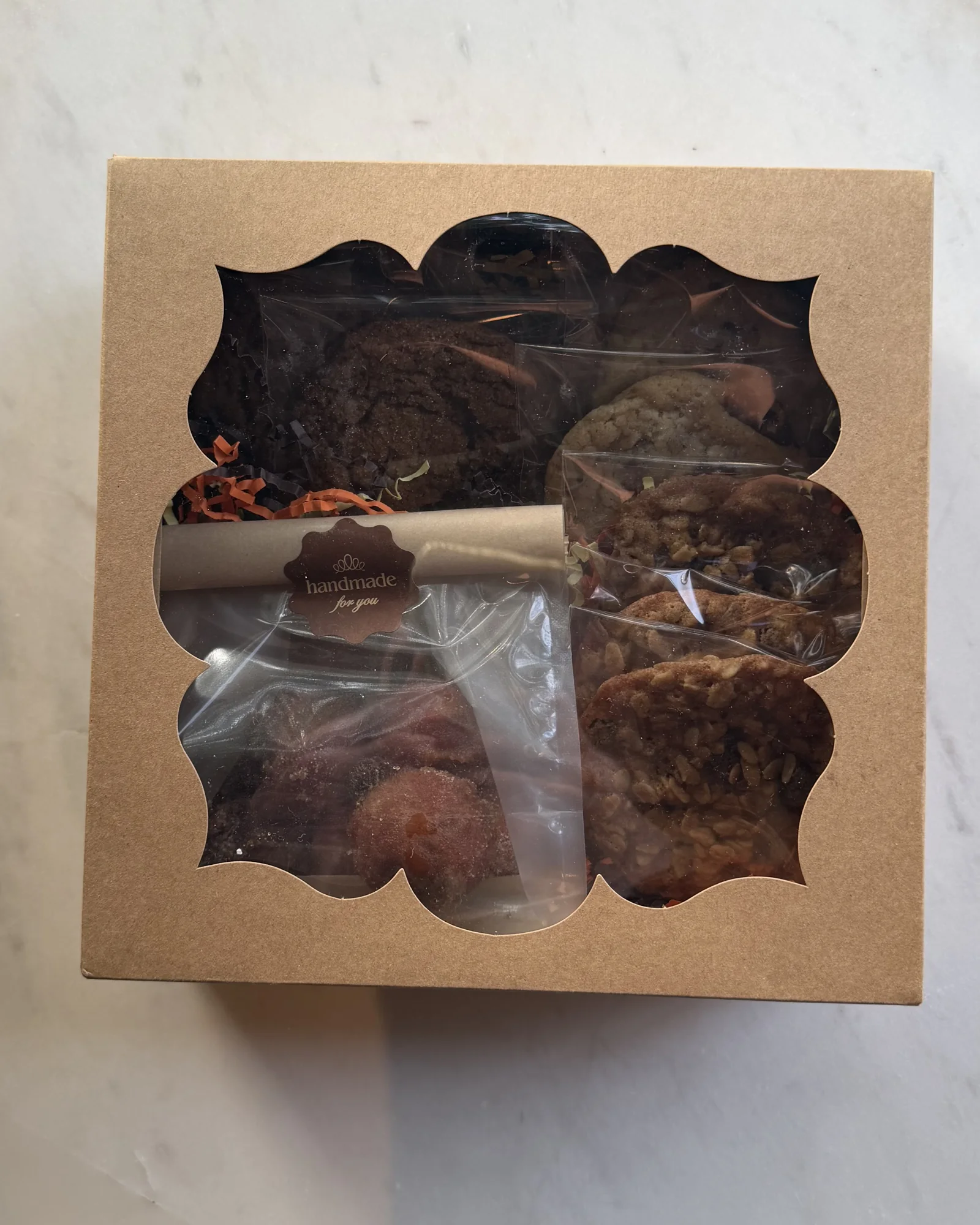 The Fall Box, closed, with cookies showing through the window