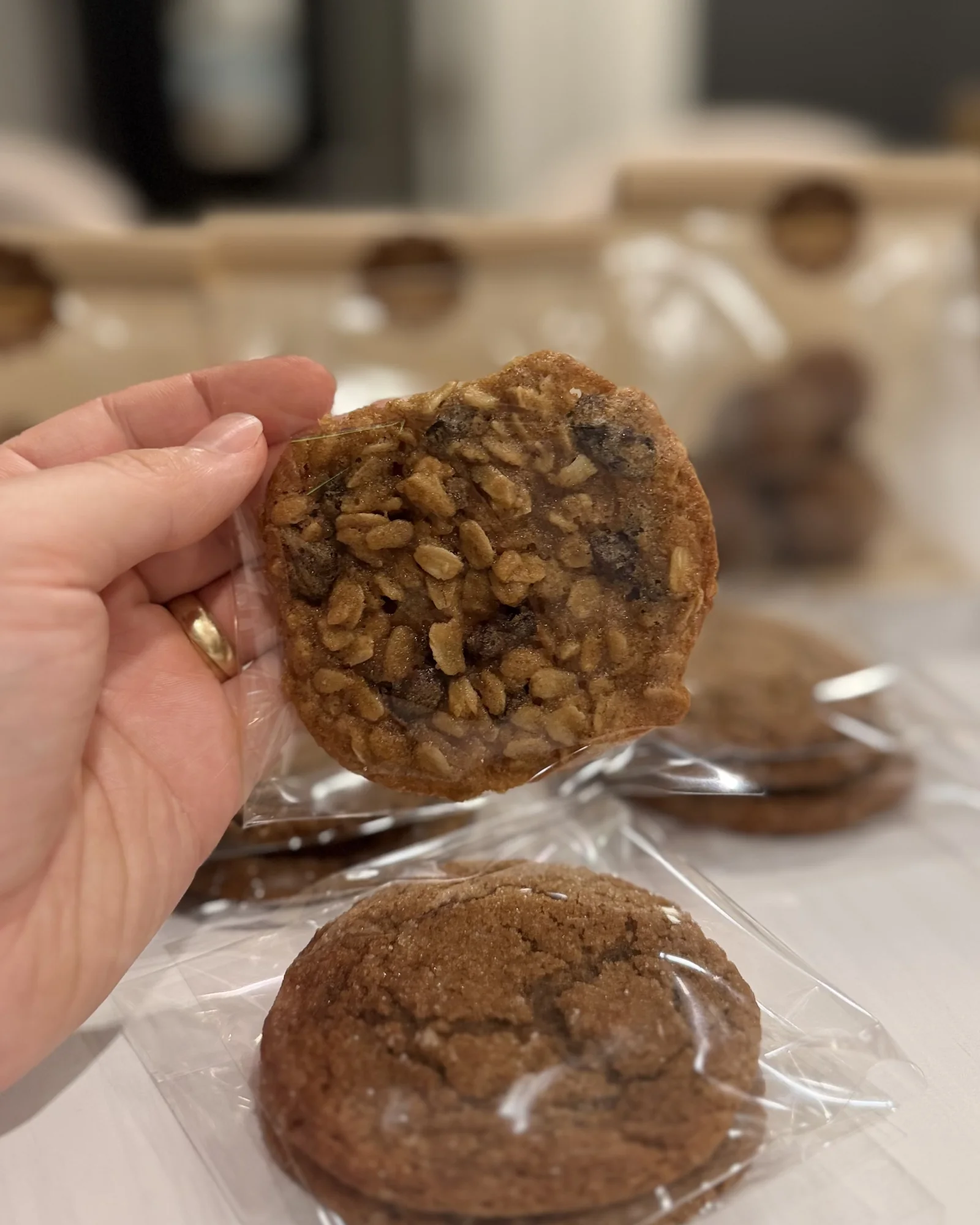 An oatmeal raisin and a ginger molasses cookie, bagged